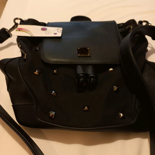 Crossbody bag new, black color, convertible to backpack