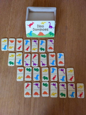 Wooden Dino Dominoes used with dinosaur images and numbers