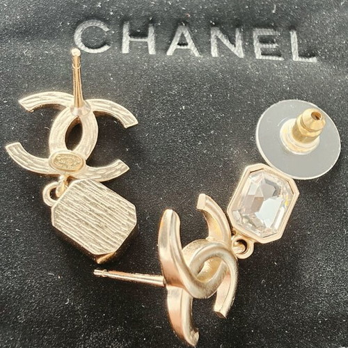 Chanel earrings with white and gold details