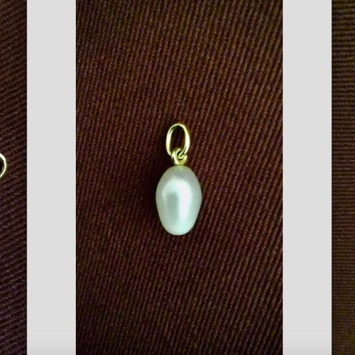 Oval Pearl Pendant like new with Gold-Plated Setting and Ring