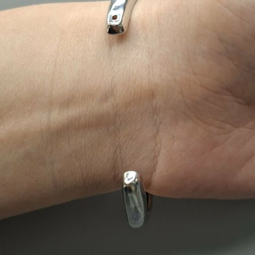 Silver metal cuff bracelet with minimal wave design