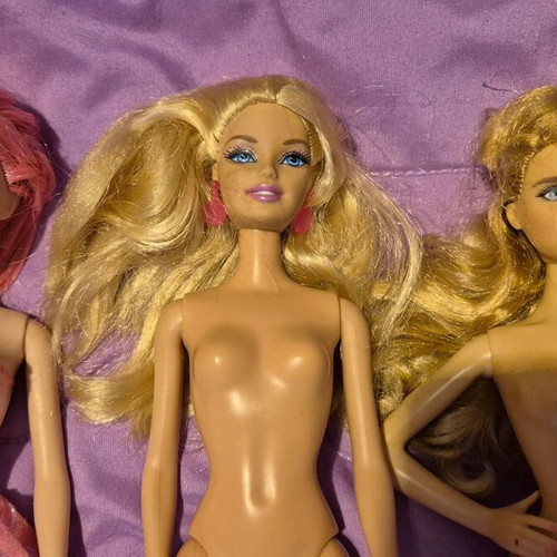 Barbie dolls used, various prices