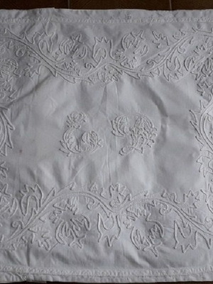 Old pillow with monogram used, hand embroidered