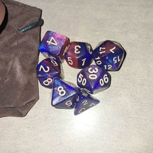 Runic leather dice bag with pink and purple D&D dice set