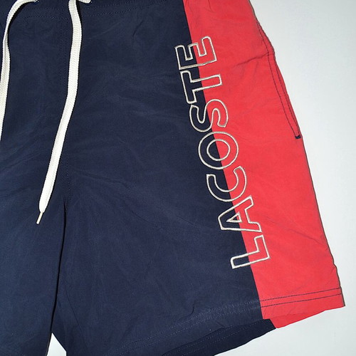 Lacoste swim shorts size 4, blue and red