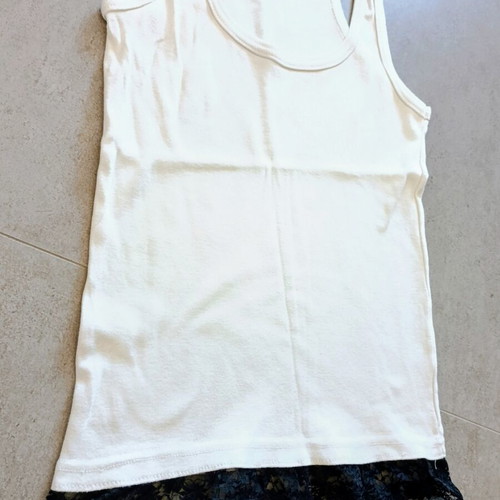 White top with black lace hem, X-back cut