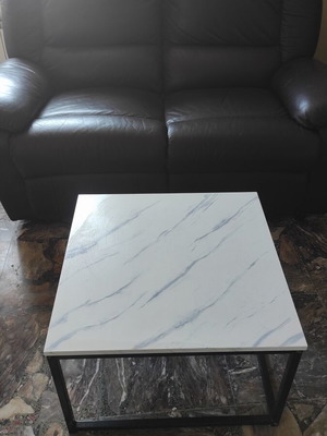 Two-seater leatherette sofa and metal coffee table set used