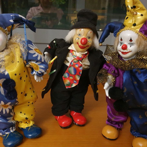 Porcelain clown dolls new, pack of 3, with music and movement