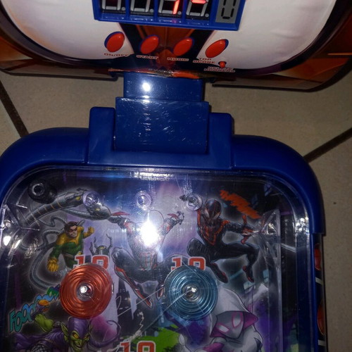Electronic tabletop pinball used with digital scoring and sound effects
