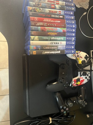 Sony PlayStation 4 Slim console used with 3 controllers and cables