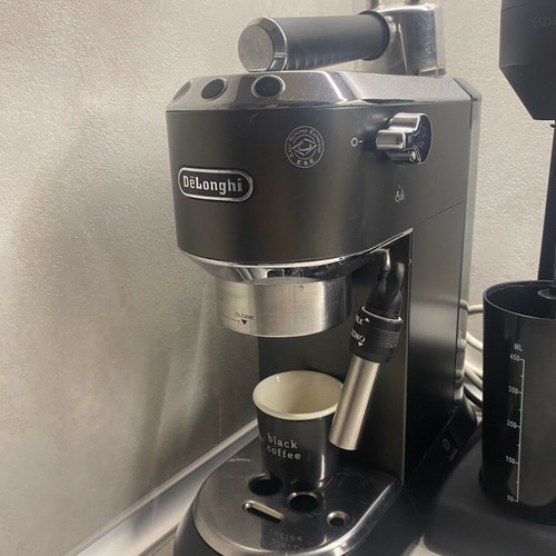Delonghi Nespresso machine used with coffee bean grinder gift