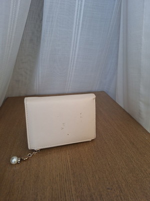 Wallet used with small marks on back