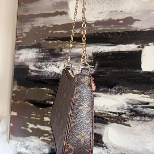 Louis Vuitton small handheld bag, leather, elegant