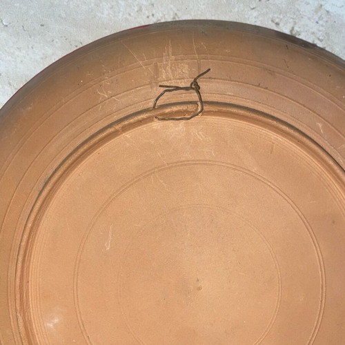 Decorative old clay plate used with minor scratches
