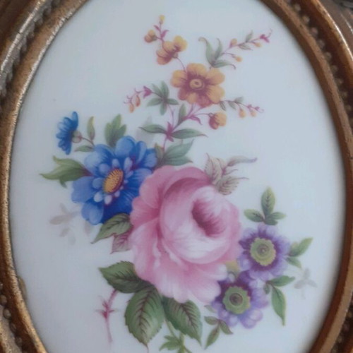 Porcelain miniatures like new with bronze border