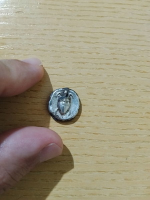Ancient Greek coin replica used, with wear