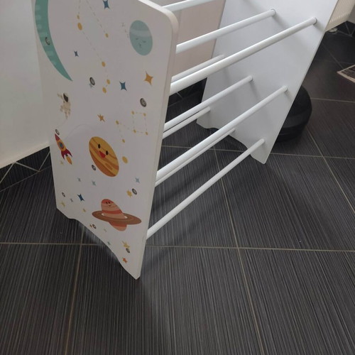 Children's storage shelf used with fabric bins and planet motifs