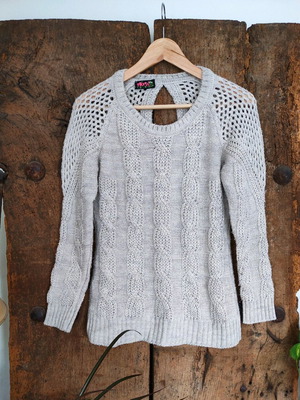 Beige knitted sweater with cable knit and open back used