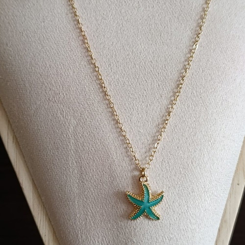 Starfish necklace in stainless steel, like new, gold color