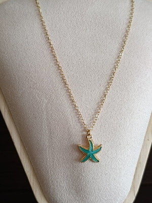 Starfish necklace in stainless steel, like new, gold color