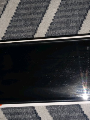 Redmi smartphone like new with box and protective case