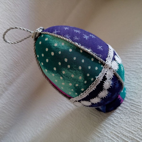 Decorative egg used blue light blue with stars and lace