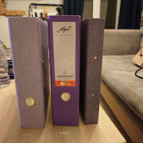 Set of three A4 filing binders in purple shades like new