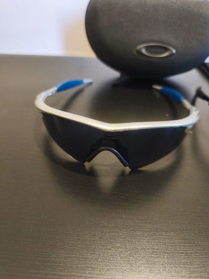 Oakley M-Frame sunglasses used with silver frame and blue lenses