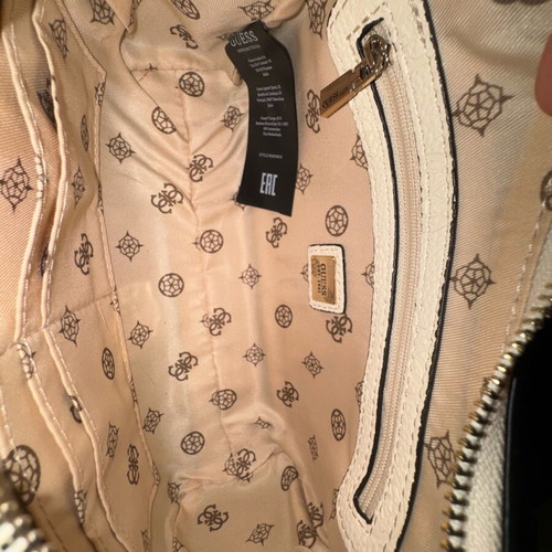 Guess white shoulder bag used with embossed logo pattern