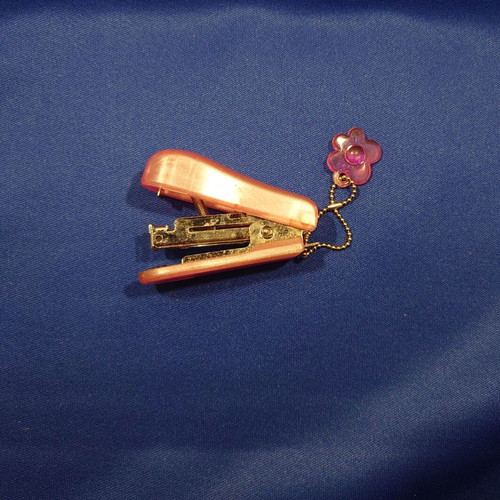 Small pink children's stapler used