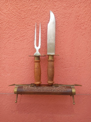 Knife and fork set used with wooden base and brass decoration