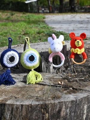 Knitted evil eyes and rattles new for newborn