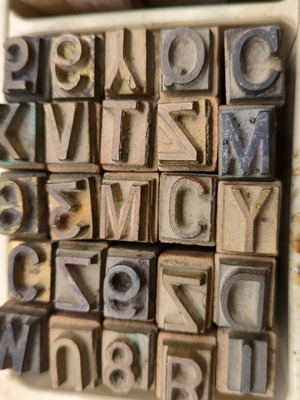 Large brass typography and bookbinding elements