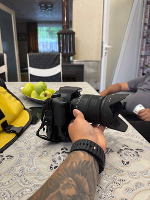 Canon EOS 1300D camera used with two batteries and charger