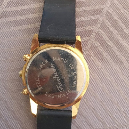 Women's black watch like new with rubber and steel
