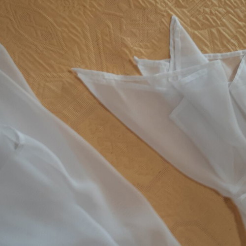 White women's shirt like new, asymmetrical with bows and cords