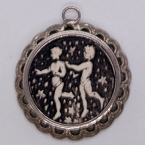Embossed Gemini pendant like new, silver