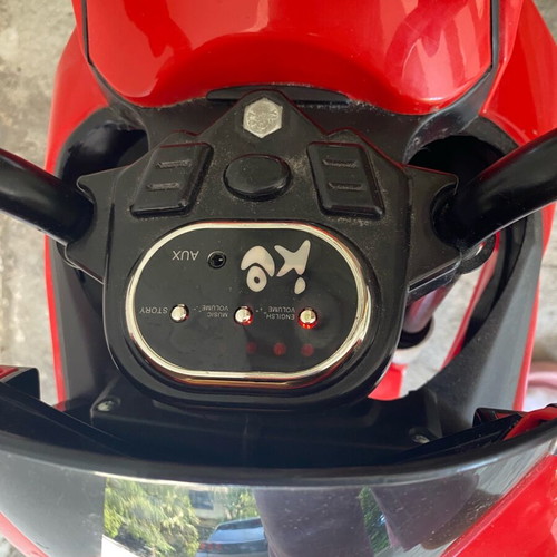 Electric children's motorcycle used with music