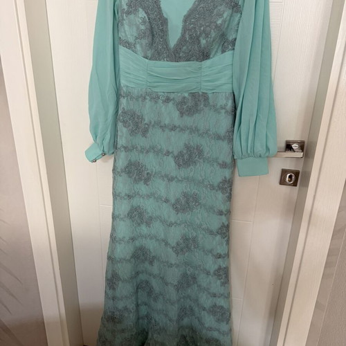 Long turquoise dress with lace embroidery and satin details