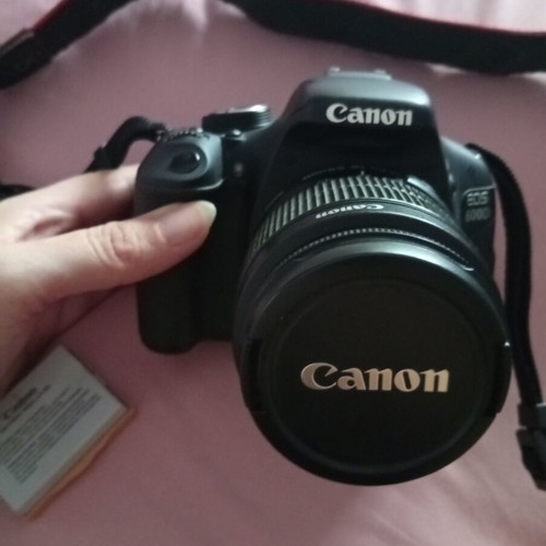 Canon EOS600D camera with 18-55mm lens, strap, charger, and two batteries