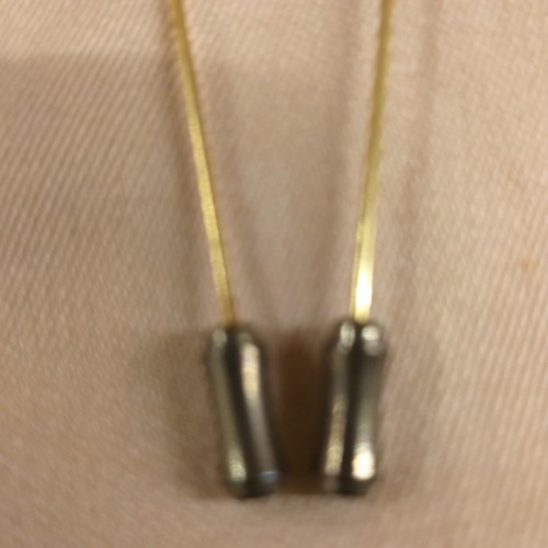 Lapel pins used, two small with enameled detail