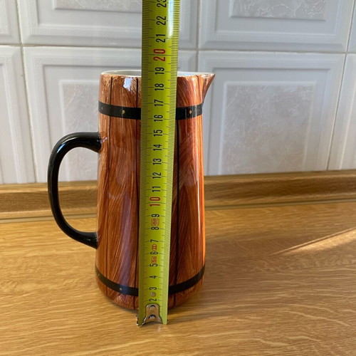 Vintage ceramic pitcher like new with wooden barrel design
