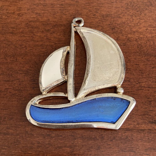 Vintage silver tone sailboat pendant with blue and white enamel