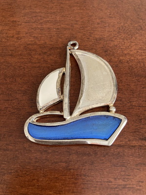 Vintage silver tone sailboat pendant with blue and white enamel