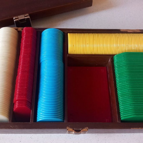 Poker chips in wooden box used
