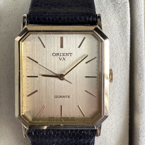 Orient VX Quartz watch, vintage gold rectangular case, brown leather strap