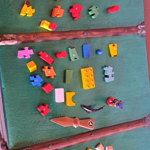Various puzzles used, assorted toys