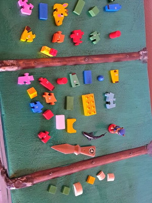 Various puzzles used, assorted toys