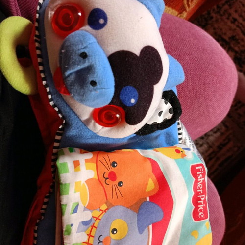 Cow toy for stroller or vintage rattle with sounds and textures