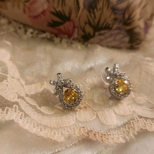 Steel earrings new with yellow stone and small diamonds